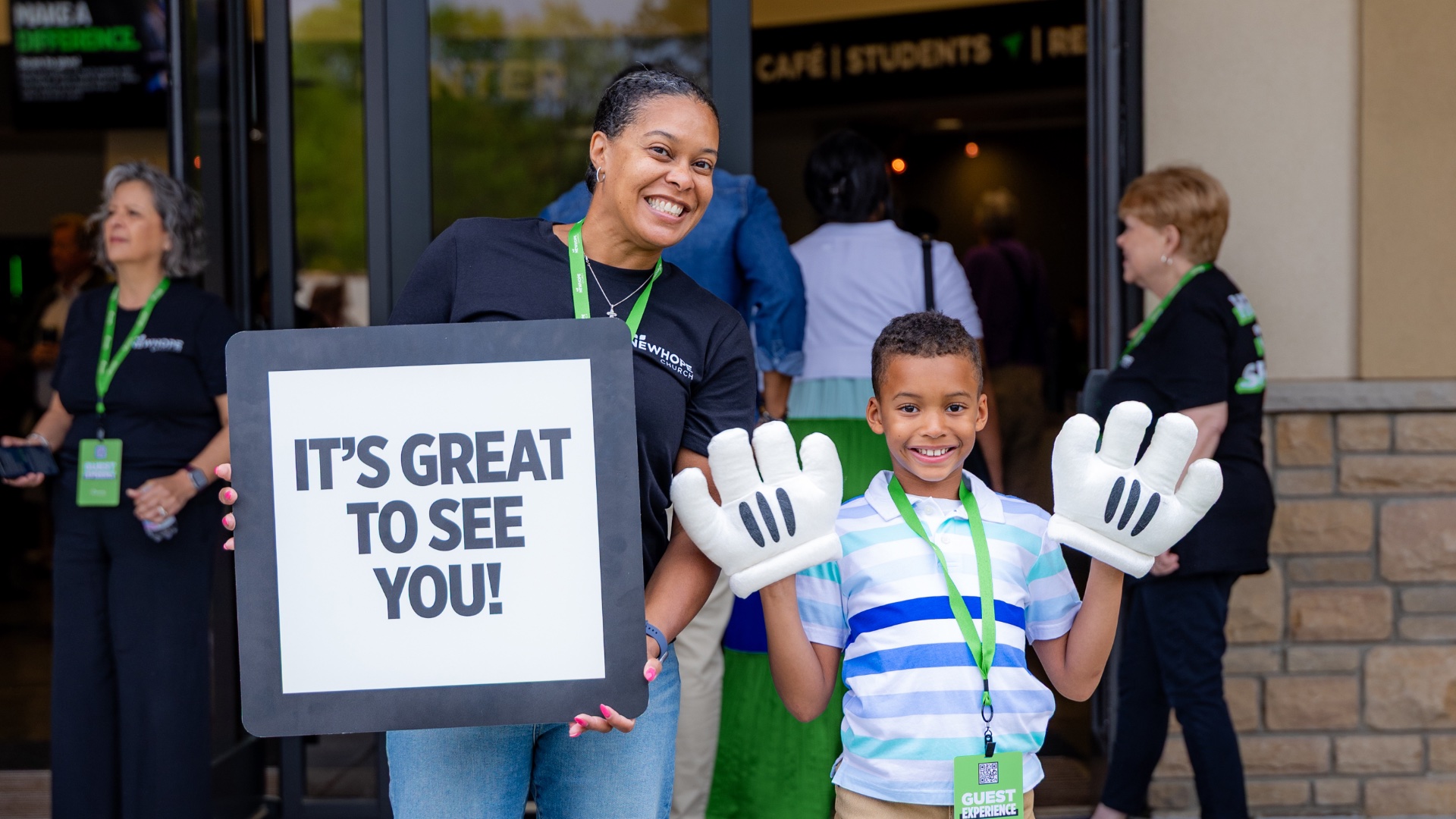 Guest Experience team mother and son welcoming new visitors!